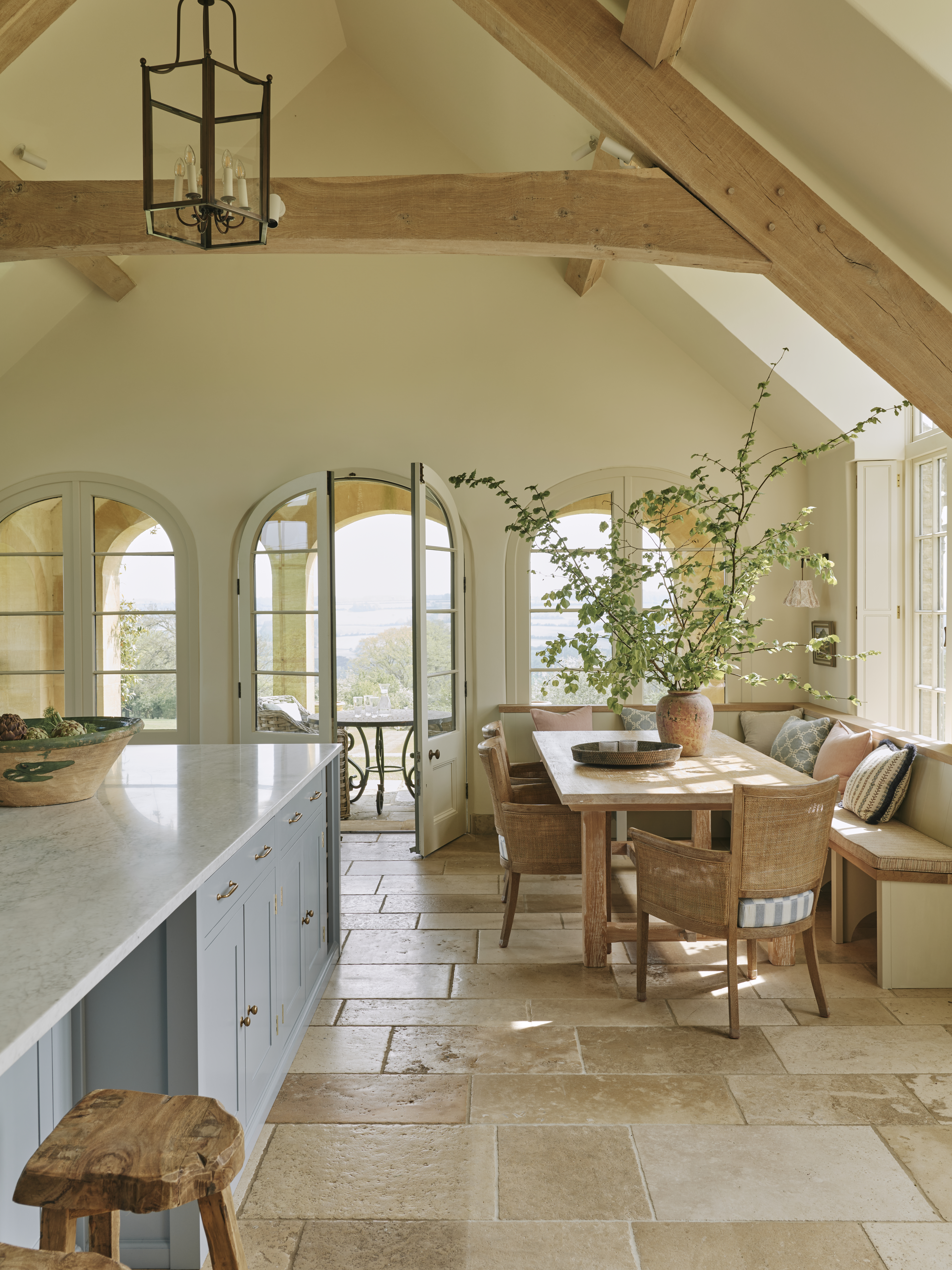 A sunlit kitchen and dining room finished in Reslac colour